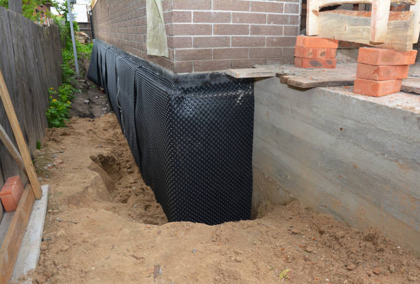 Happy homeowners after waterproofing job in Laurelville